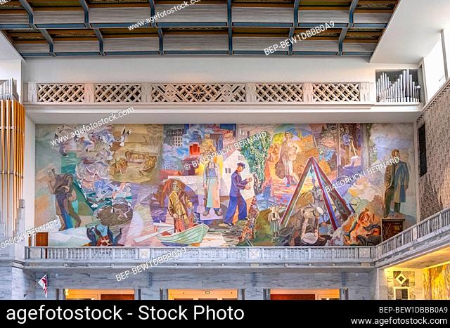 Oslo, Ostlandet / Norway - 2019/08/30: Oslo City Hall historic building - Radhuset - with wall painting decoration by Alf Rolfsen in Pipervika quarter of city...