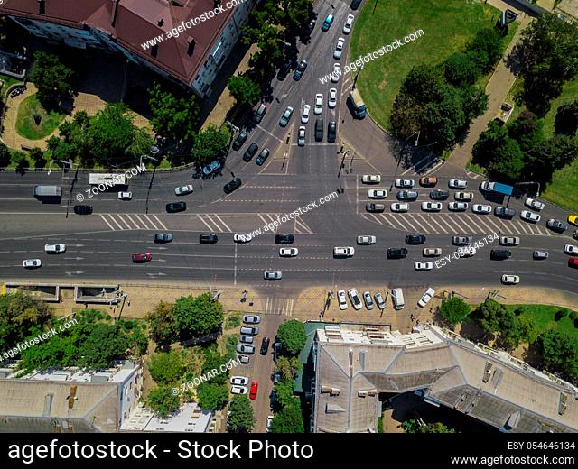 Abstract overhead aerial view of traffic driving navigating through busy street