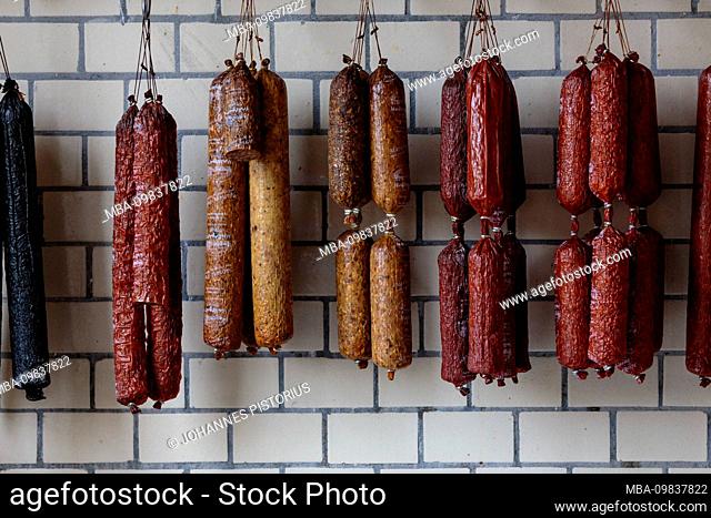 Europe, Denmark, Bornholm, Rønne. Fresh sausages from the regional butcher in the Torvehal shopping hall