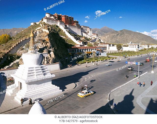 Traffic on the streets of Lhasa with the Potala