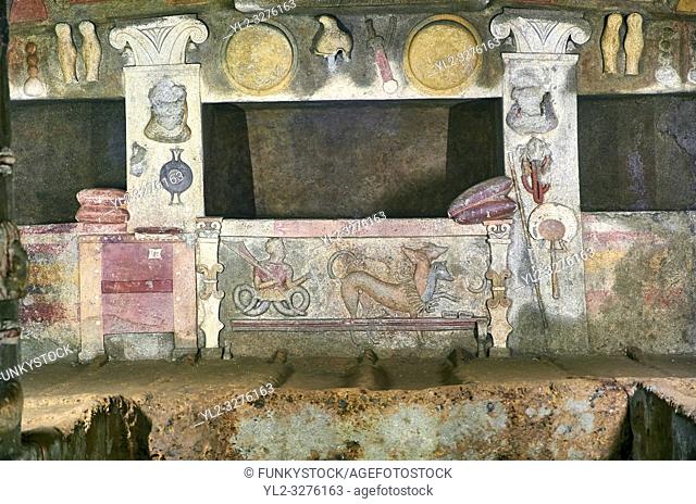 Interior of the Tomb of Reliefs that has everyday Etruscan objects carved into the volcanc Tuff rock, as well as separate burial chambers with rock pillows