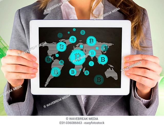 Bitcoin icons on world map and woman holding tablet