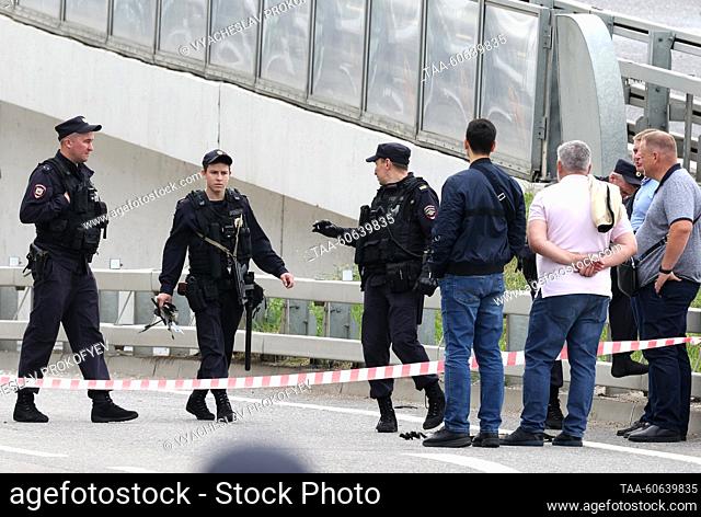 RUSSIA, MOSCOW - JULY 24, 2023: Law enforcement officers are seen by a damaged business centre in Likhacheva Prospekt Street after a drone attack