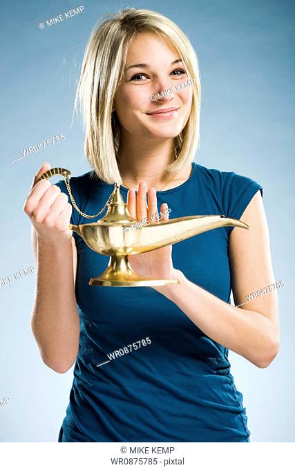 woman rubbing a magic lamp