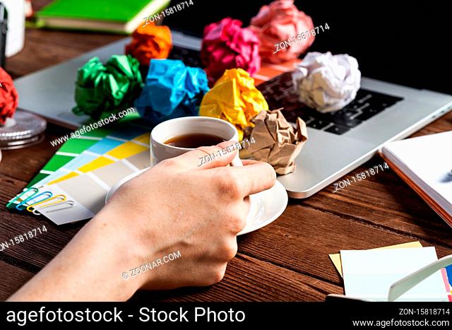 Woman blogger or columnist relax with coffee. Freelancer working at wooden desk. Business occupation and innovation technology