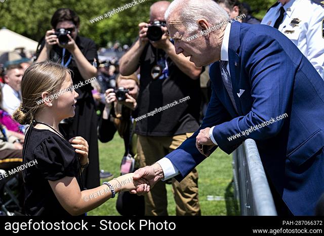 United States President Joe Biden shakes hands with Jovi Kate Humphrey, 9, granddaughter of fallen law enforcement officer Wendell Humphrey of Baldwin County