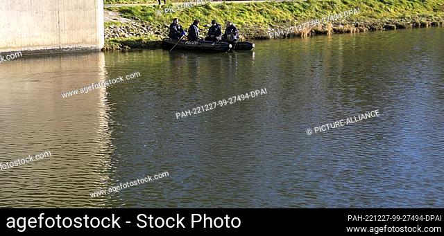 27 December 2022, Bavaria, Nuremberg: Divers search for clues under a bridge. Police have begun searching the Main-Danube Canal near Nuremberg in the search for...