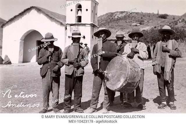 A group of Peruvian Musicians with traditional pipes and large bass drums. The principal instrument is the pan flute or pan pipe (also known as panflute or...