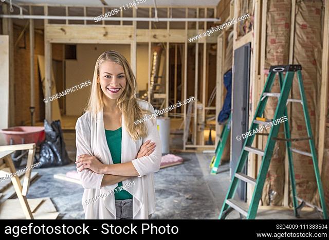 Woman smiling at construction site