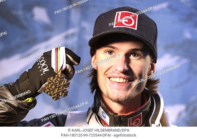 Daniel Andre Tande of Norway holds up his gold medal at the Ski Flying World Championships in Oberstdorf, Germany, 20 Janaury 2018