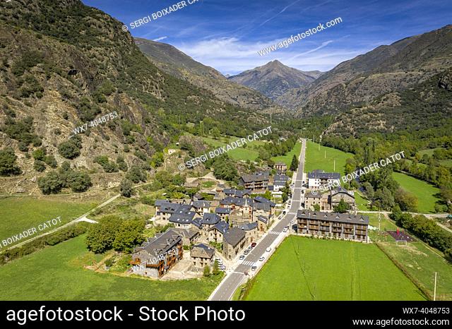 Aerial view of the village of Ainet de Cardós and the surrounding green fields in the Cardós valley (Pallars SobirÃ , Lleida, Catalonia, Spain, Pyrenees)