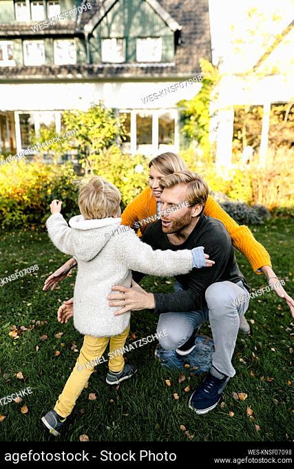 Happy affectionate family in garden