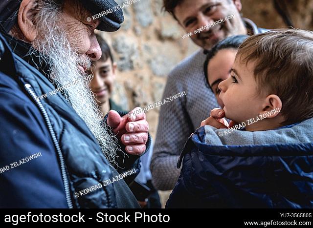 Father Dario Escobar Maronite monk meets with tourists in his hermitage of Our Lady of Hawqa in Kadisha Valley also called Holy Valley in Lebanon