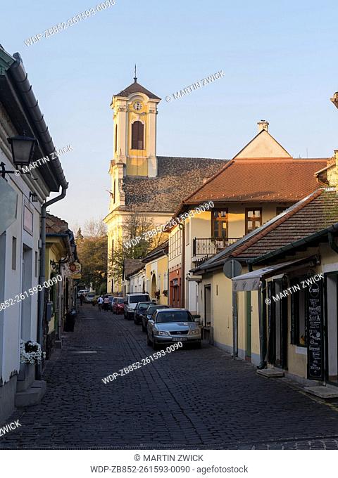 Szentendre near Budapest, a historic small town on the banks of the Danube. Sunset over in the old town with the catholic church of Peter and Paul