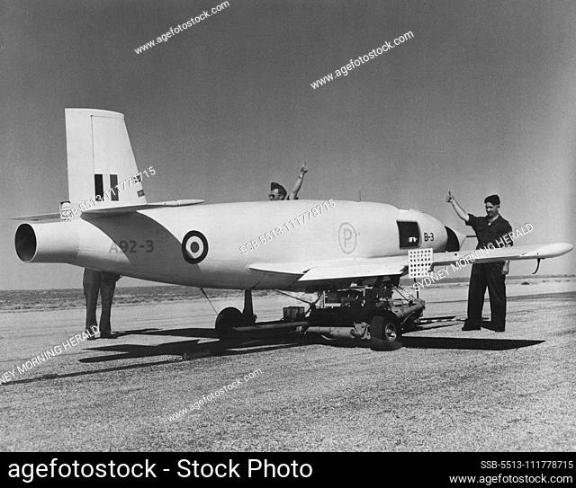 A ground crew gives the ""thumbs up (she's ready)"" sign to ***** a Jindivik pilotless, jet, radio-controlled target aircraft ***** for launching. Mr