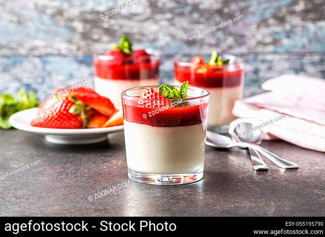 Italian dessert panna cotta in glass with strawberries