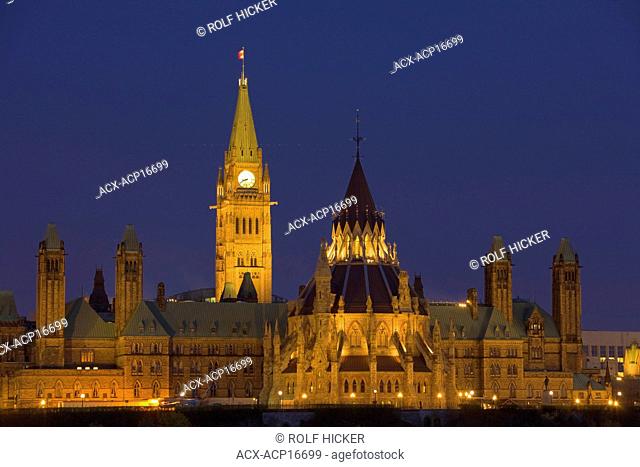 View of Parliament Hill seen from Nepean Point at dusk in the city of Ottawa, Ontario, Canada