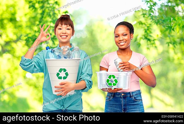 happy women sorting plastic and metallic waste