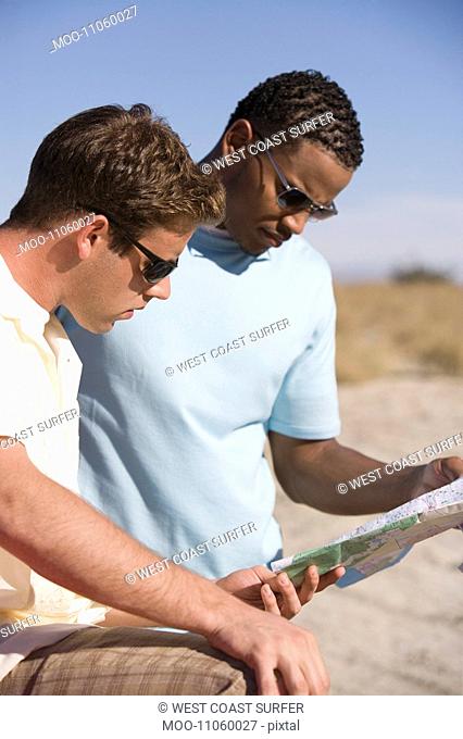 Men Looking at Road Map