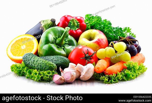 Composition with fresh vegetables and fruits isolated on white background