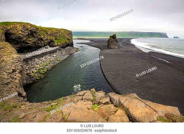 Beautiful view from Dyrholavegur, of black volcanic sand beach in Vik, Iceland