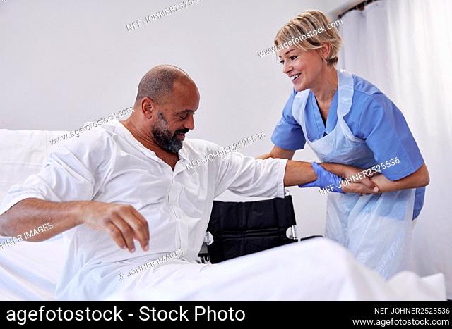 Nurse taking care of patient in hospital