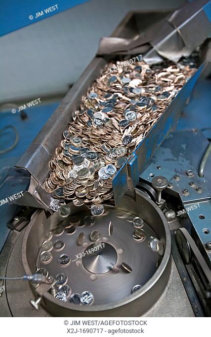 Denver, Colorado - Production of coins at the United States Mint  Finished dimes go through a counting machine before being packaged for distribution