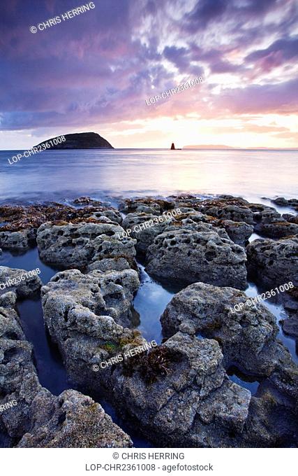 Wales, Isle of Anglesey, Puffin Island. Dawn view of Puffin Island, a Special Protection Area SPA, largely because of its Great Cormorant colony