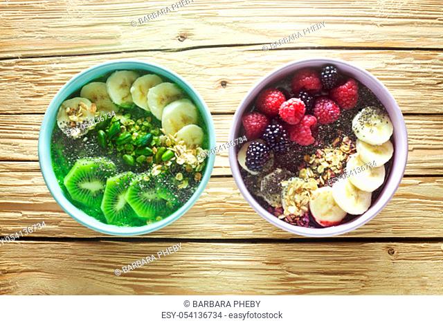 Two Smoothie Bowls On A Wooden Background