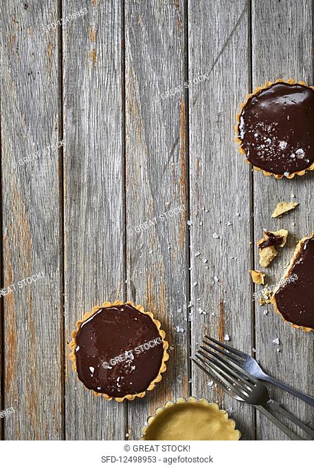 Salted caramel, chocolate and peanut butter tartlets
