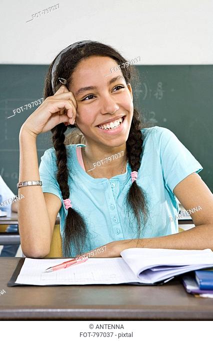 A schoolgirl sitting at a desk