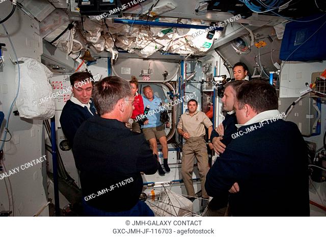 This view captures a reunion among six NASA astronauts, three Russian cosmonauts and a Japanese astronaut in the International Space Station's U.S