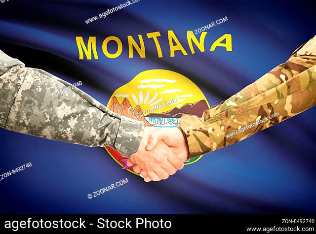 Soldiers handshake and US state flag - Montana