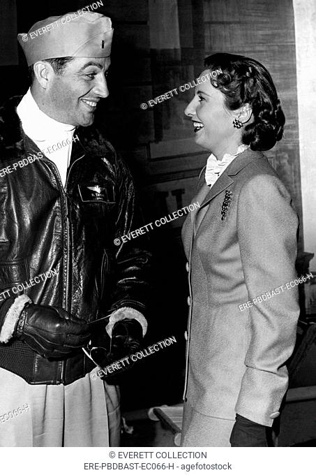 Navy lieutenant Robert Taylor during a furlough visit with wife Barbara Stanwyck before assuming his duties as a flying instructor in Livermore, California