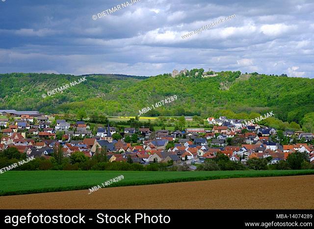 view of the community of gössenheim and the castle ruins homburg in the nature reserve ruine homburg, lower franconia, franconia, bavaria, germany