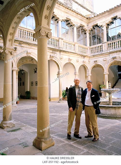 Lord and son in the courtyard at Castillo de Canena, Canena, near Úbeda, Andalusia, Spain