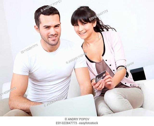Young couple shopping in internet