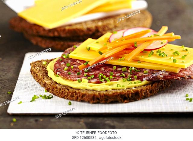 Power Bread: wholegrain bread with mustard, salami, cheddar, vegetables and chives