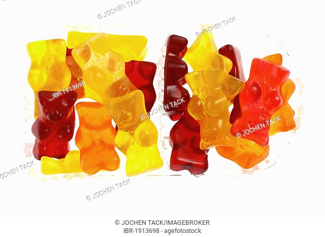 Differently colored gummy bears in a clear plastic packaging