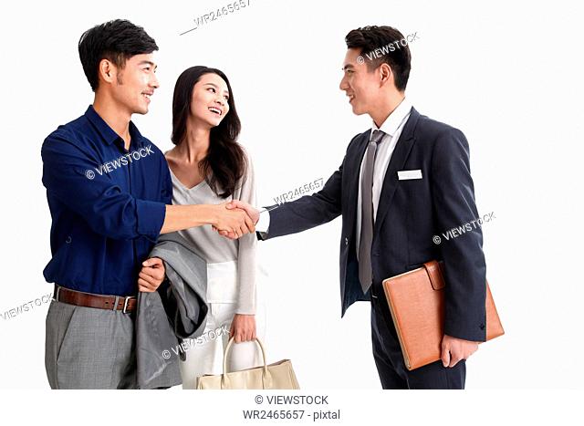 Young couple with car dealer