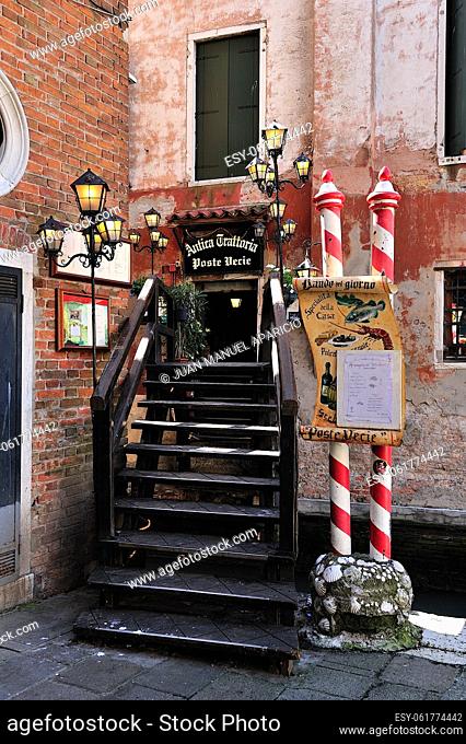 Detail of a small bridge to a trattoria in Venice, Italy