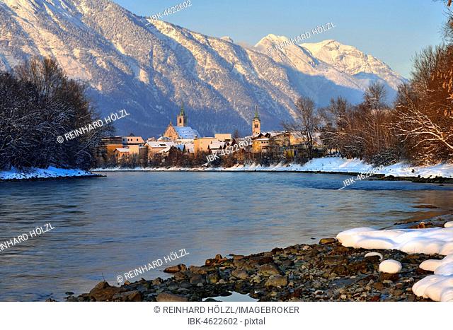 River Inn with city centre in winter, at the back mountains Stanser-Joch and Rofan Mountains, Schwaz, Tyrol, Austria