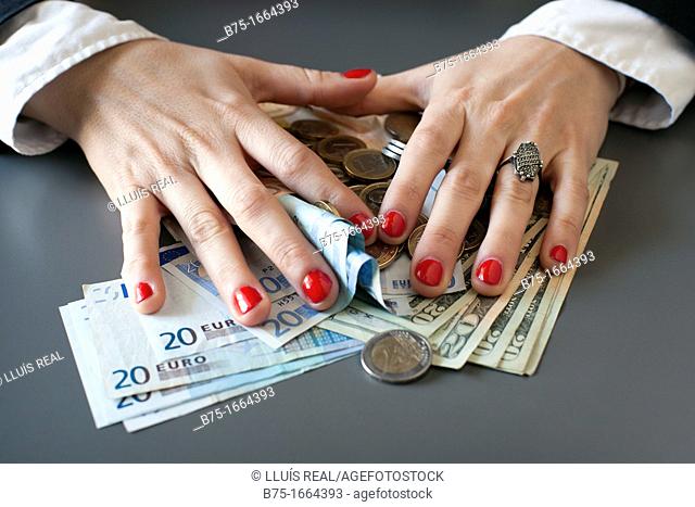 young woman hands counting euros and dollars