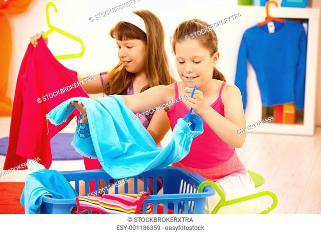 Schoolgirls helping with housework