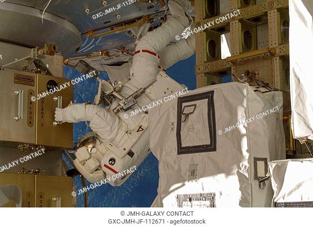 Astronaut Shane Kimbrough, STS-126 mission specialist, participates in the mission's fourth and final scheduled session of extravehicular activity (EVA) as...