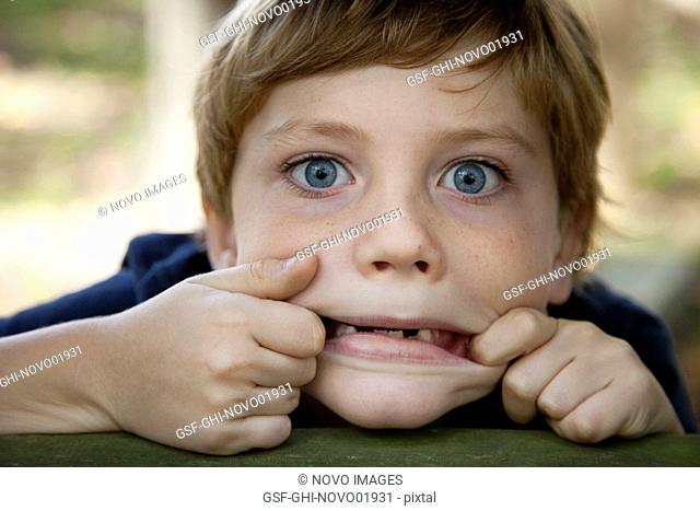 Young Boy Making Funny Face, Close-Up