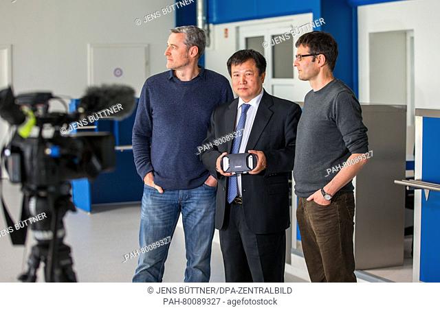 Chinese investor Jonathan Pang (c) together with the film directors Stefan Eberlein (r) and Manuel Fenn (l) during the preview of 'Parchim International' at the...