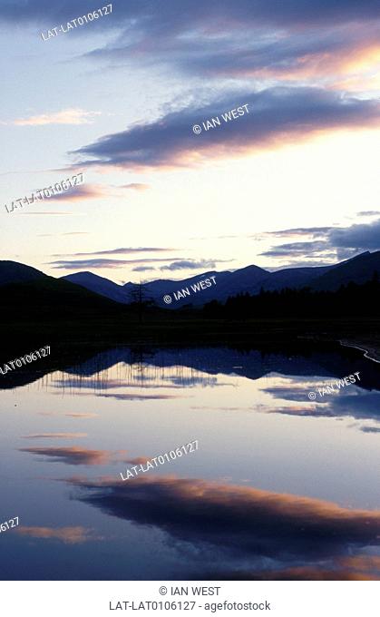 Meall an Araich. Beinn Suide. Mountains. Dusk. Silhouettes. Light on water