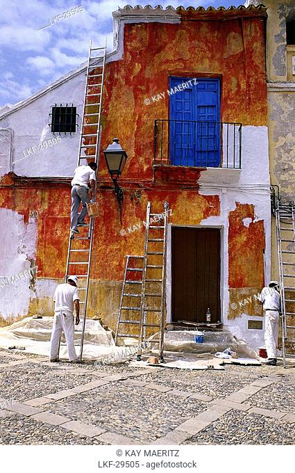 Painters painting a house's facade, Antequera, Andalucia, Spain