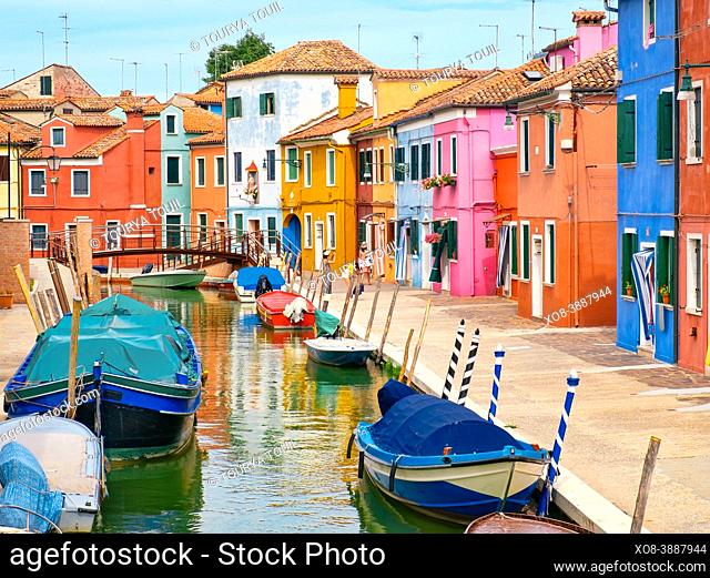 Colorful houses and canals on the italian island of Burano near Venice
